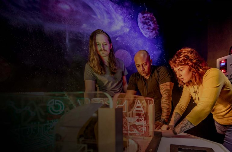 Group solving puzzle in escape room